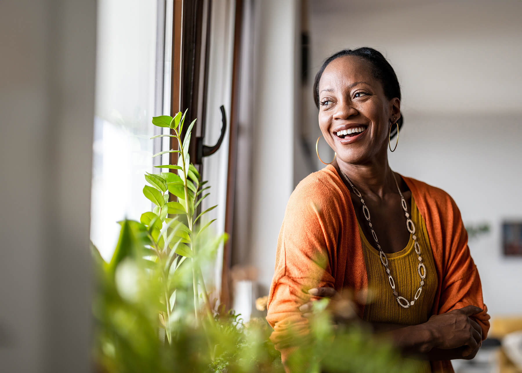 Happy woman by a window