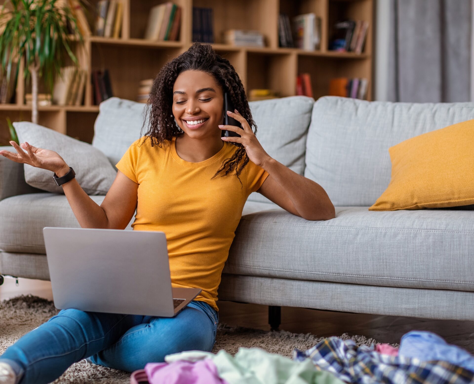 lady using laptop and talking on phone